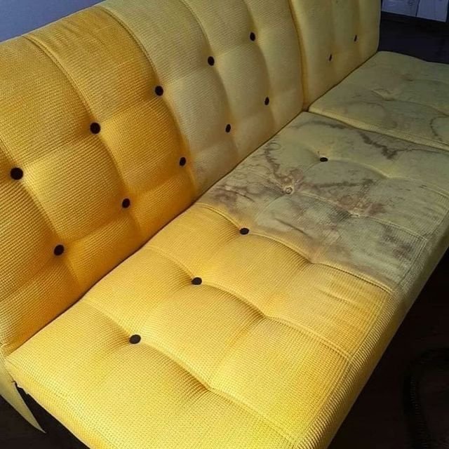 Upholstery cleaning showing treated and stained sections of a sofa